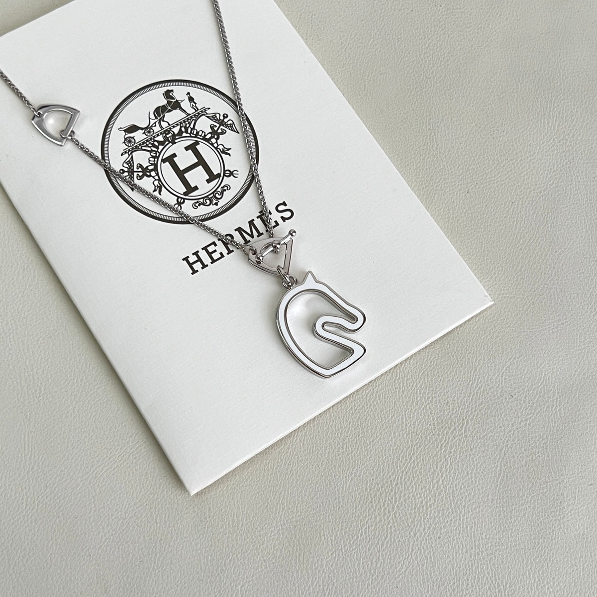 Hermès Silver-Tone H Disc and Horse-Outline Pendant Necklace - album image 1
