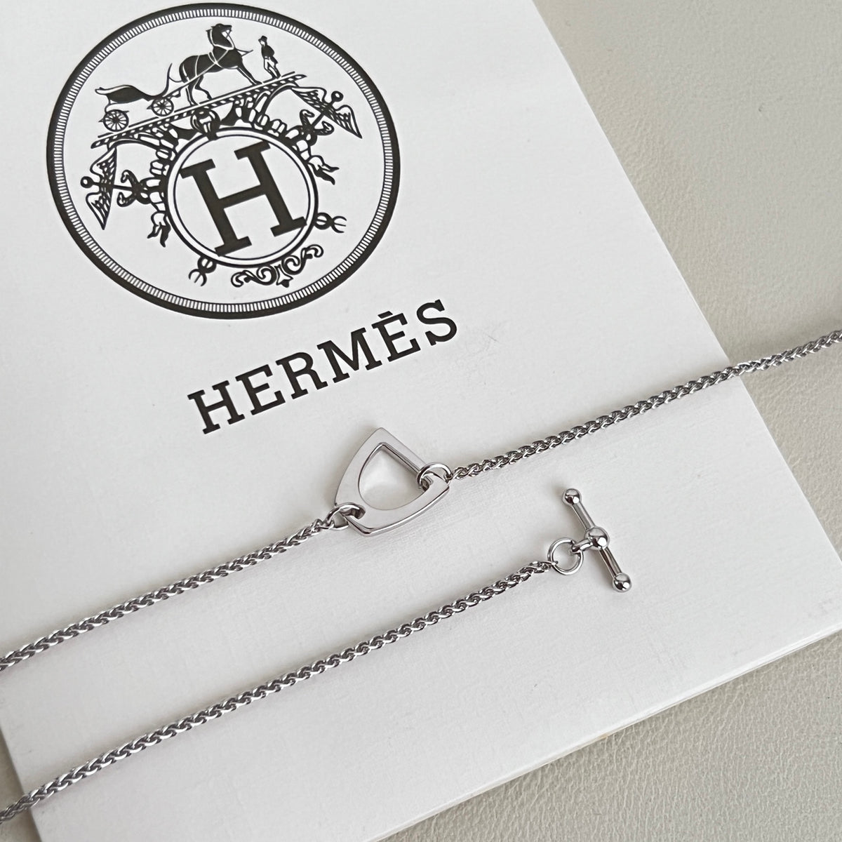 Hermès Silver-Tone H Disc and Horse-Outline Pendant Necklace - album image 9