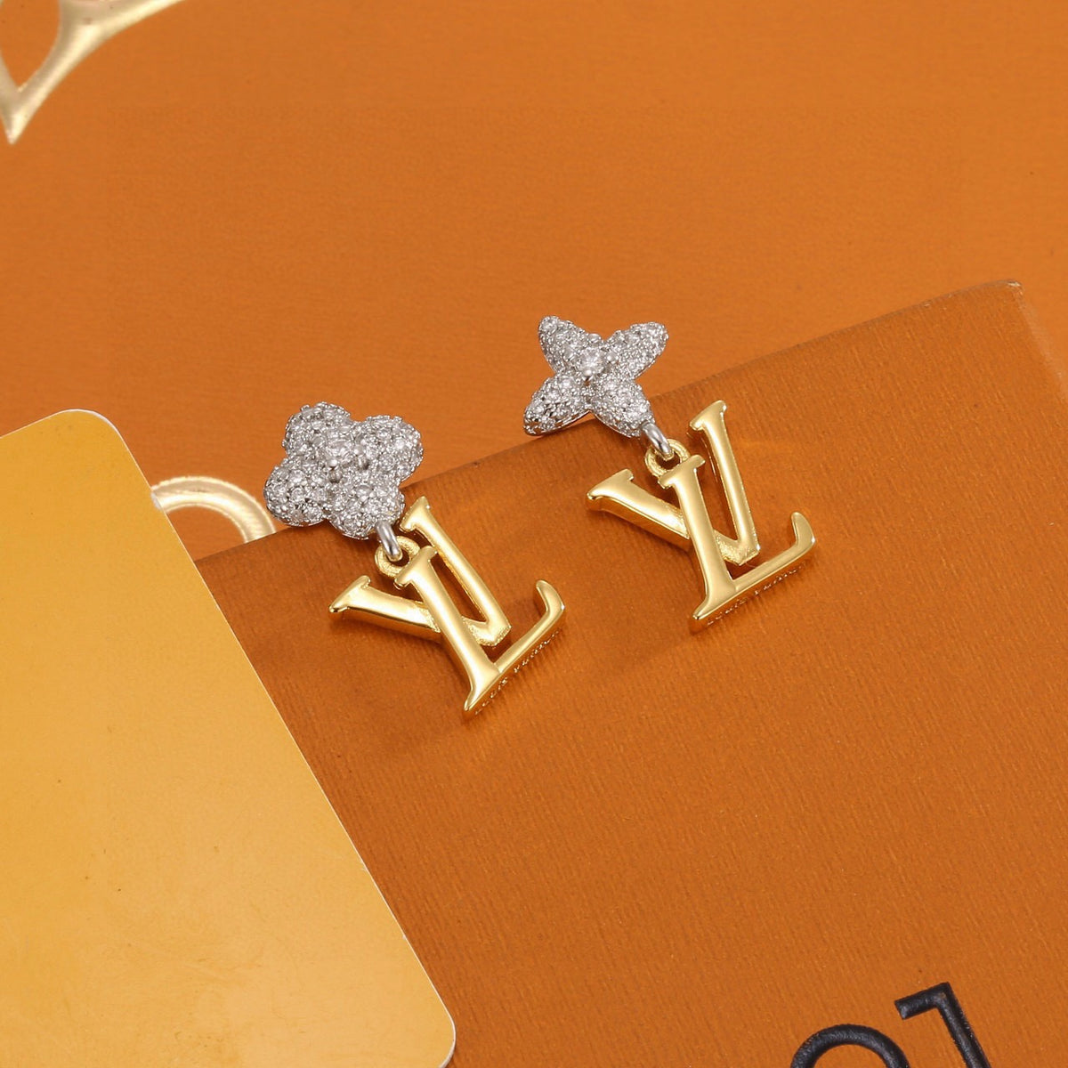 Louis Vuitton Gold-Tone LV and Flower Stud Earrings - album image 1