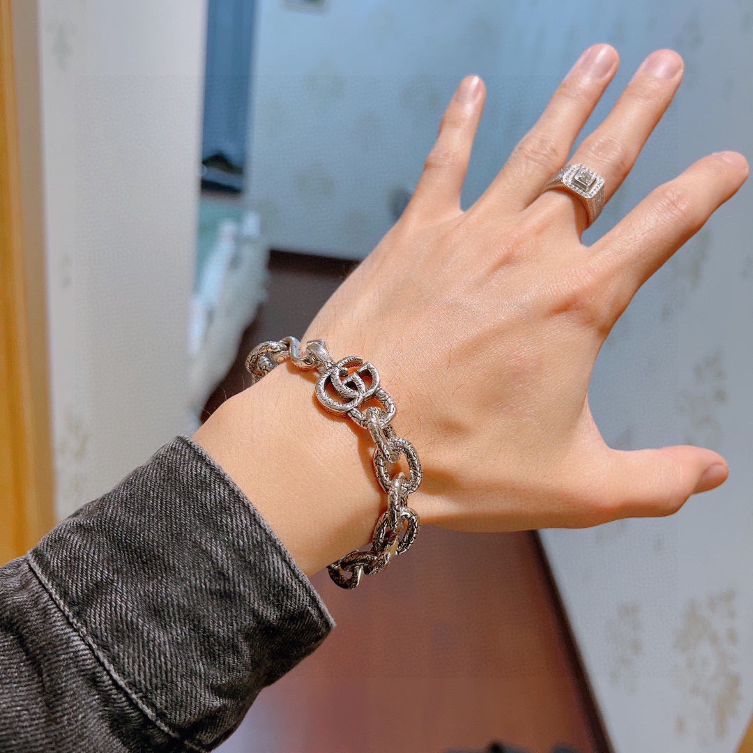 Gucci Silver-Tone Openwork Oval Link Bracelet with G Charm - album image 6