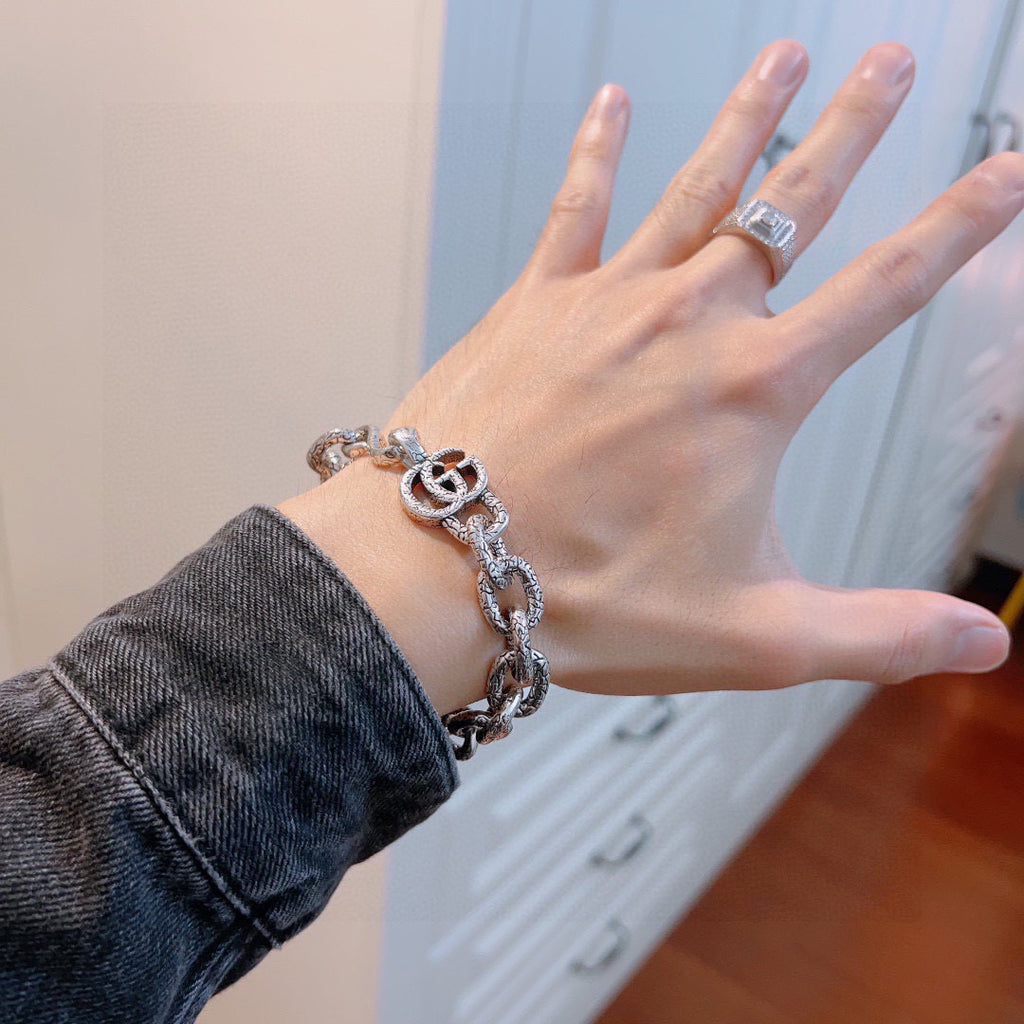 Gucci Silver-Tone Openwork Oval Link Bracelet with G Charm - album image 9