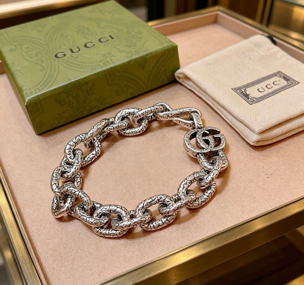 Gucci Silver-Tone Openwork Oval Link Bracelet with G Charm - album image 1