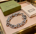 Gucci Silver-Tone Openwork Oval Link Bracelet with G Charm - album image 1