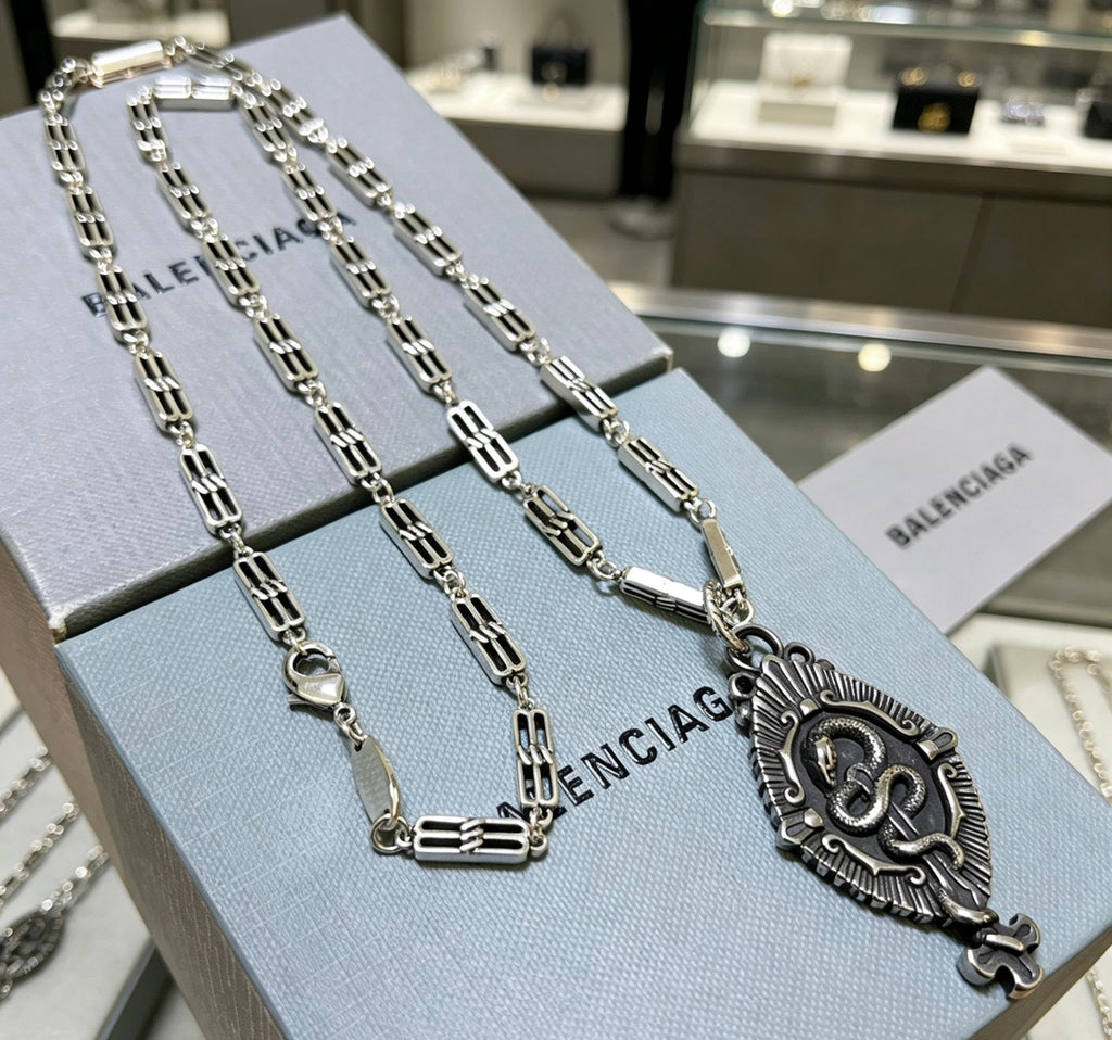 Balenciaga Silver-Tone Ornate Oval Pendant Necklace - album image 1