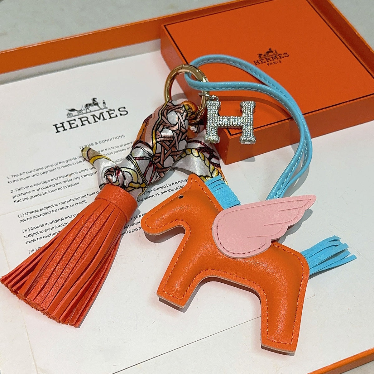 Hermès Orange Horse Bag Charm with Blue Cord and Tassel - album image 6