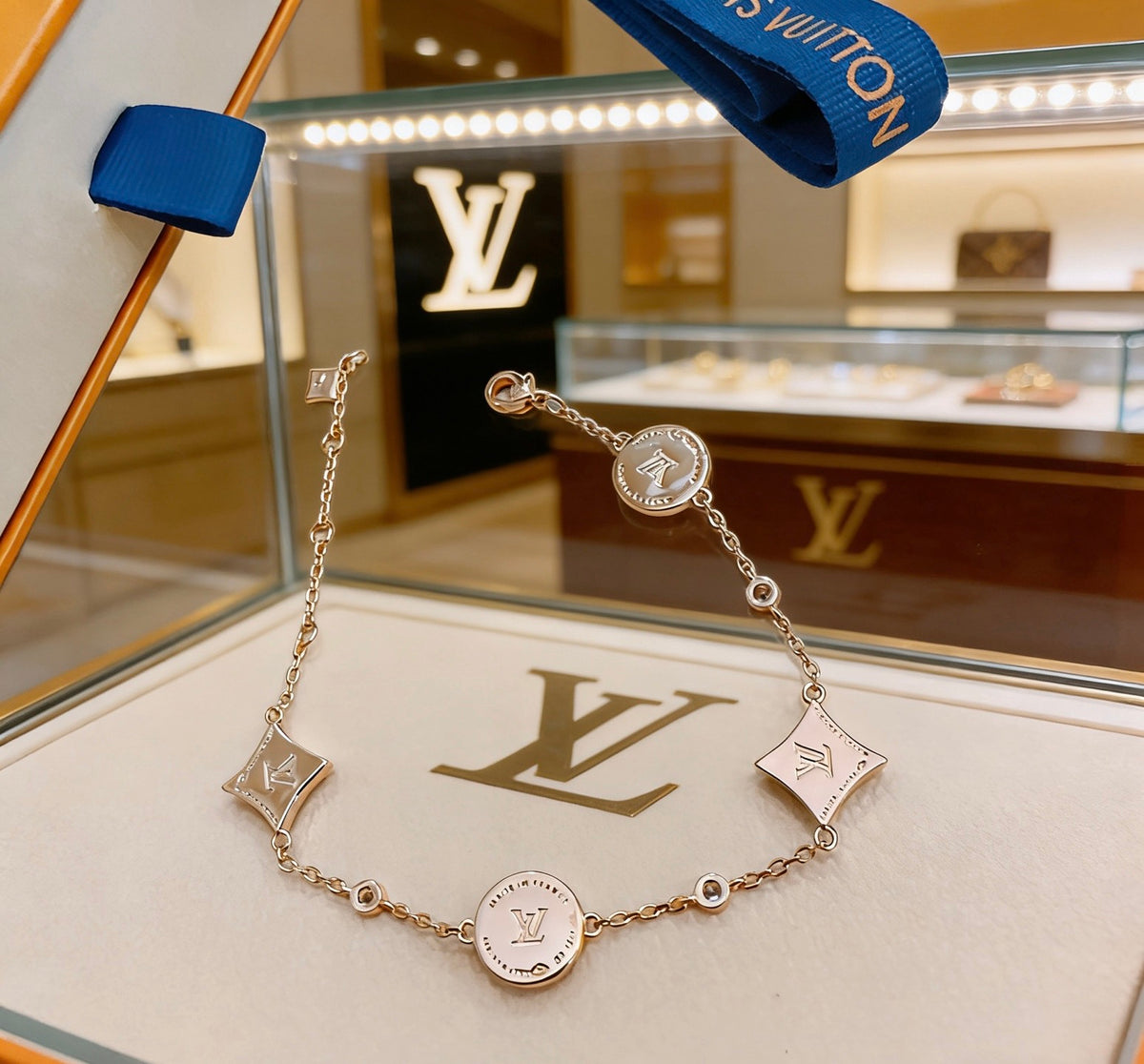 Louis Vuitton Gold-Tone Flower Charm Bracelet with Blue Accent - album image 5