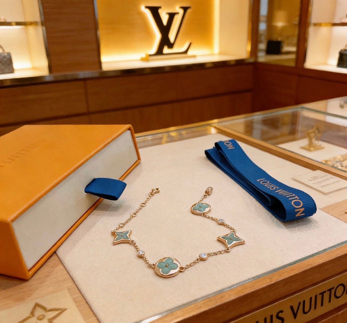 Louis Vuitton Gold-Tone Flower Charm Bracelet with Blue Accent - album image 3