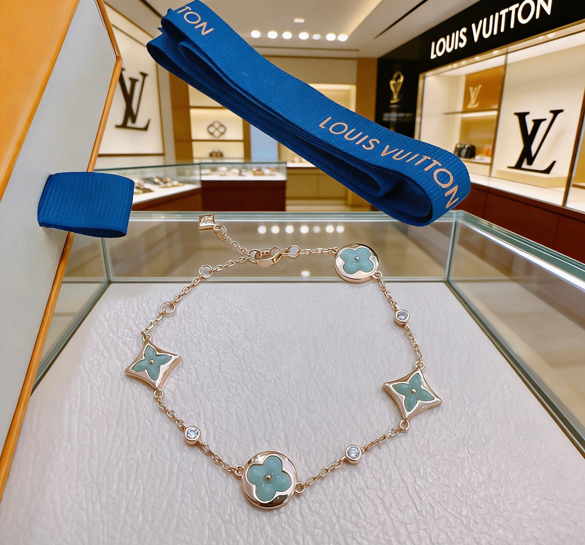 Louis Vuitton Gold-Tone Flower Charm Bracelet with Blue Accent - album image 2