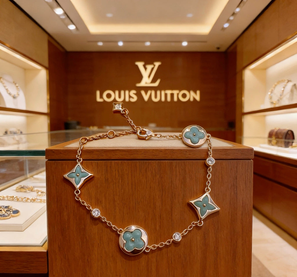 Louis Vuitton Gold-Tone Flower Charm Bracelet with Blue Accent - album image 1