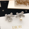 Dior Silver-Tone Asymmetric Crystal Bow Earrings - product image 1