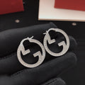 Gucci Silver-Tone Circular Earrings - album image 1