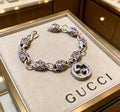 Gucci Silver-Tone GG Medallion Bracelet with G Charm - album image 1