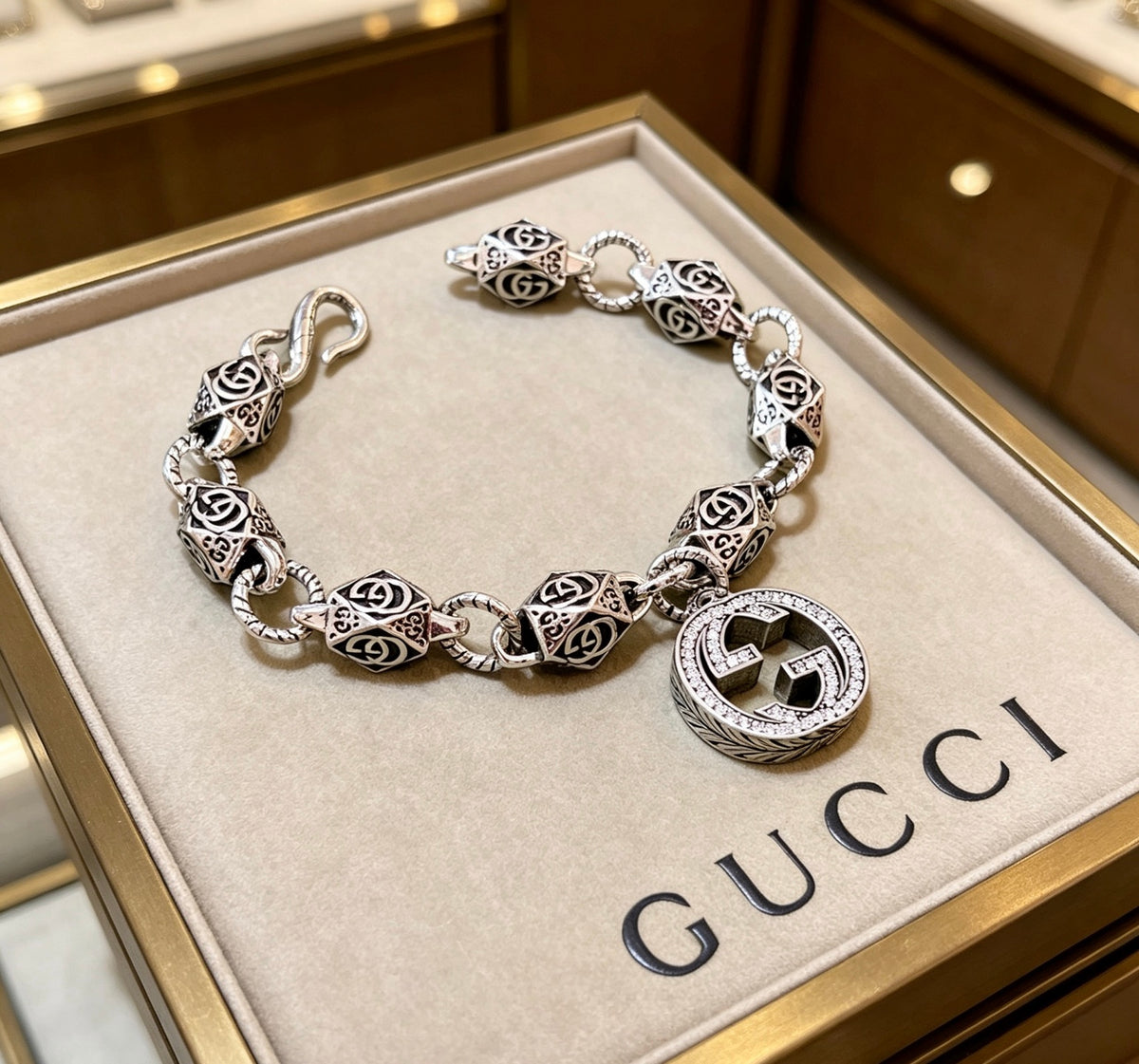 Gucci Silver-Tone GG Medallion Bracelet with G Charm - album image 1