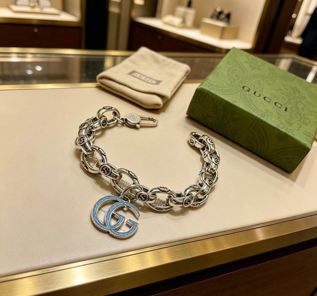 Gucci Silver-Tone Textured Link Bracelet with G Charm - album image 1