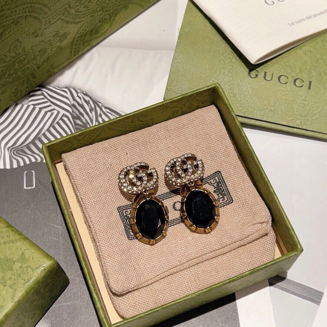 Gucci Interlocking G Antique Gold-Tone White Black GG Letter Earrings - album image 1