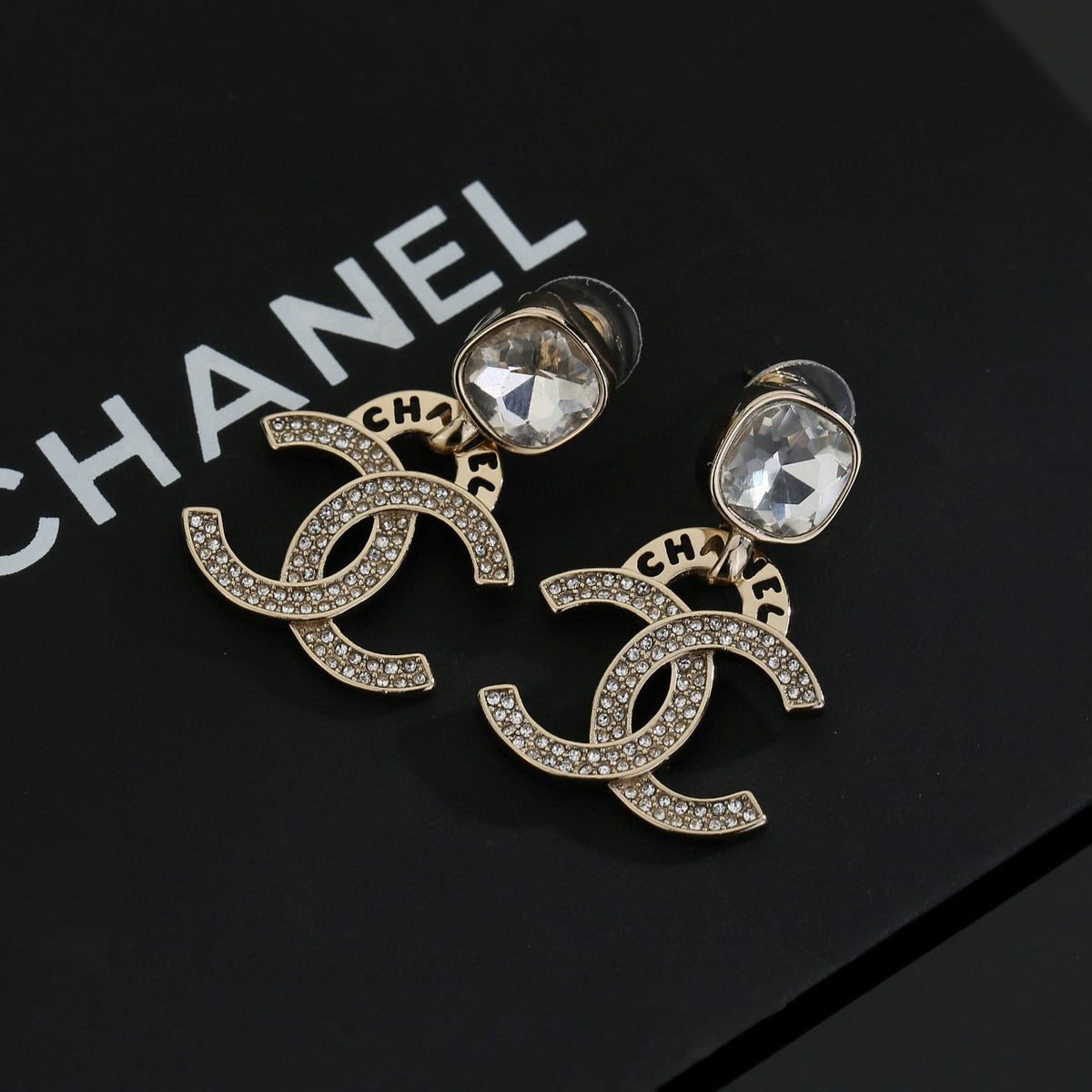 Chanel Interlocking C Resin Gold-Tone Stud Earrings - album image 1