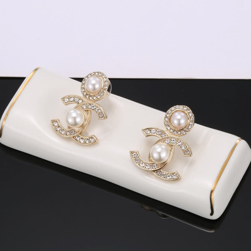 Chanel Gold-Tone CC and Pearl Drop Earrings - album image 1
