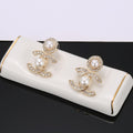 Chanel Gold-Tone CC and Pearl Drop Earrings - album image 1