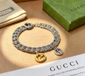 Gucci Silver-Tone Cuban Link Bracelet with Two-Tone G Charm - album image 1