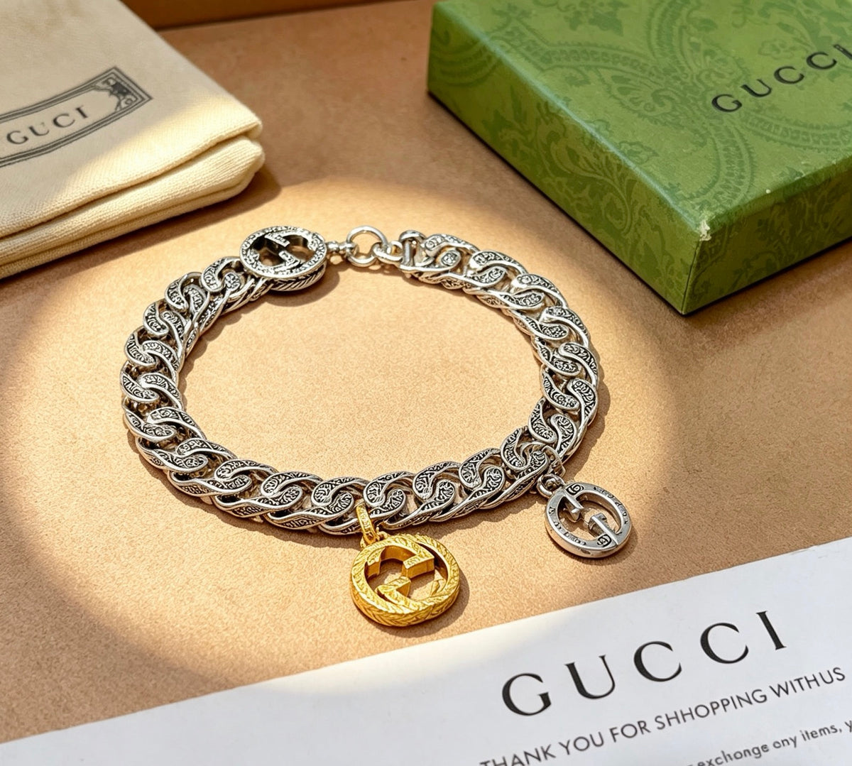 Gucci Silver-Tone Cuban Link Bracelet with Two-Tone G Charm - album image 1