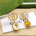 Gucci Interlocking G Antique Gold-Tone Black Antiqued Earrings - album image 1