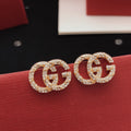 Gucci Rose Red Twisted Earrings - album image 1