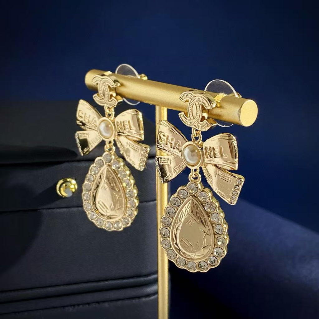 Chanel Interlocking C Bow Butterfly Gold-Tone Stud Earrings - album image 7
