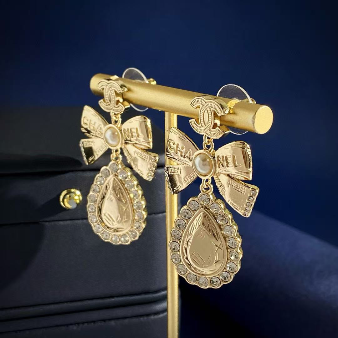 Chanel Interlocking C Bow Butterfly Gold-Tone Stud Earrings - album image 7