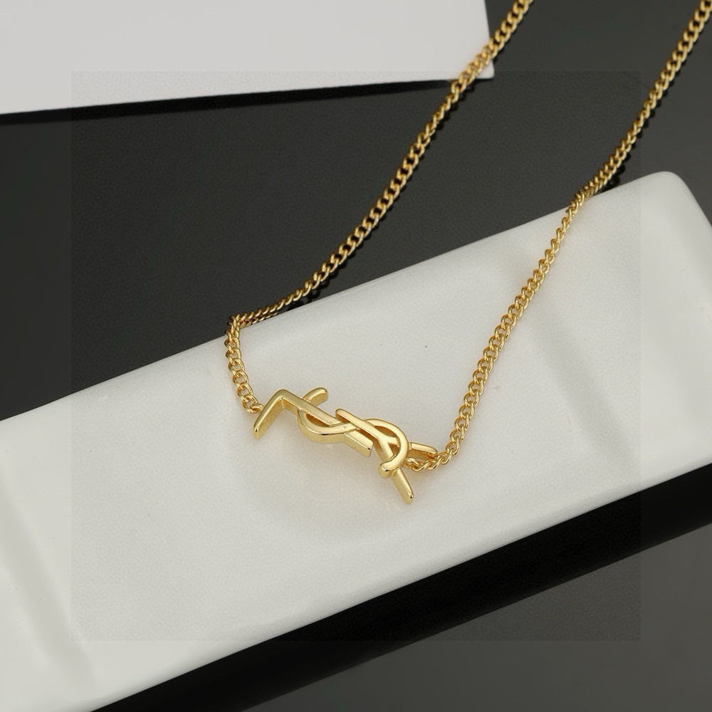 Saint Laurent Gold-Tone Monogram Pendant Necklace - album image 9