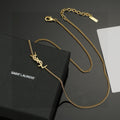 Saint Laurent Gold-Tone Monogram Pendant Necklace - album image 1