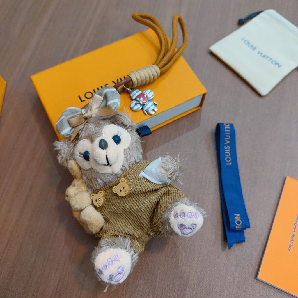 Louis Vuitton Gray Plush Character Keychain in Tan Outfit - album image 2