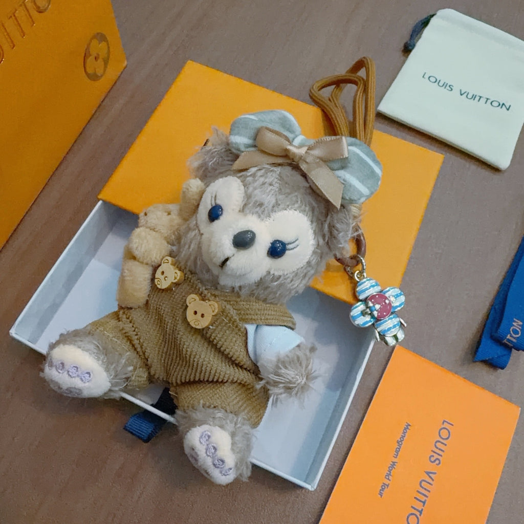 Louis Vuitton Gray Plush Character Keychain in Tan Outfit - album image 4