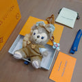 Louis Vuitton Gray Plush Character Keychain in Tan Outfit - album image 1