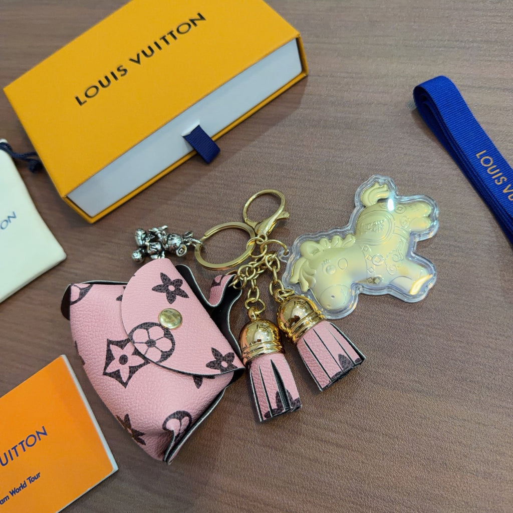 Louis Vuitton Yellow Character Keychain with Pink Monogram Tag - album image 2