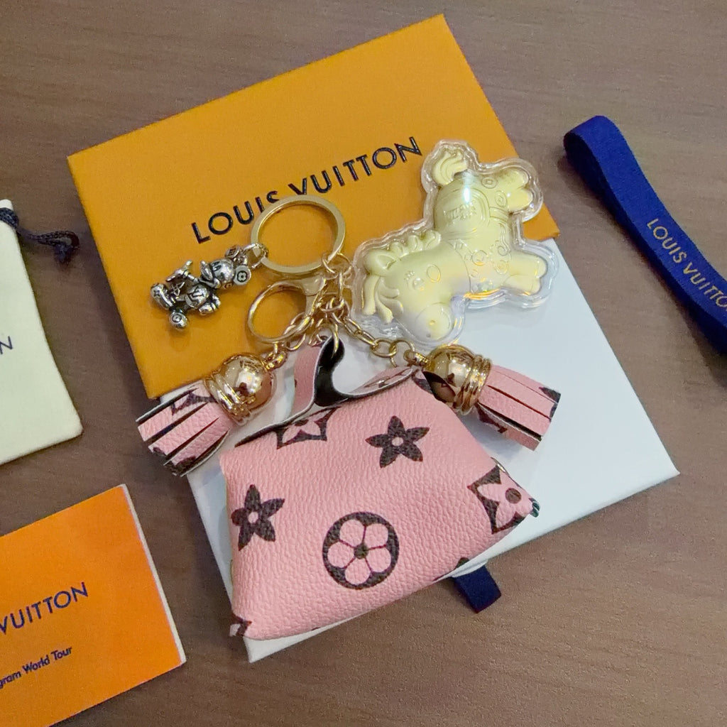 Louis Vuitton Yellow Character Keychain with Pink Monogram Tag - album image 1
