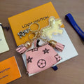 Louis Vuitton Yellow Character Keychain with Pink Monogram Tag - album image 1