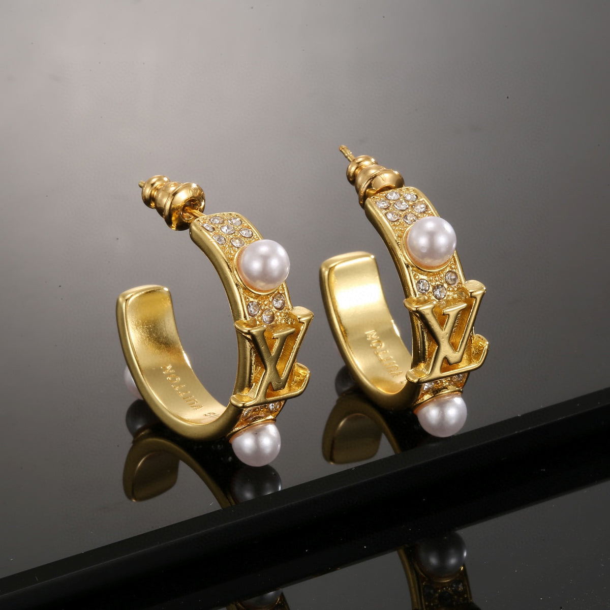 Louis Vuitton LV Letter Stud Earrings - album image 1