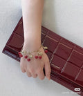 Saint Laurent Antique Gold-Tone Red Accent Bracelet - album image 1