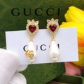 Gucci Teardrop Pearl Earrings - album image 1