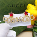Gucci Red Star Crystal Accent Earrings - album image 1