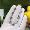 Gucci Silver-Tone Blue Crystal and G Charm Bracelet - album image 1