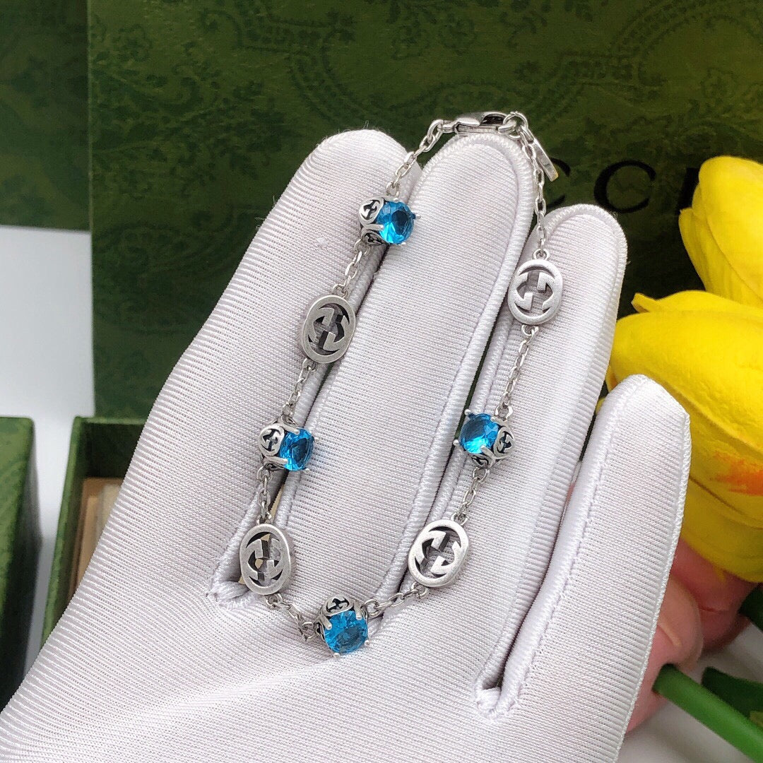 Gucci Silver-Tone Blue Crystal and G Charm Bracelet - album image 1
