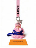 Louis Vuitton Pink Ribbon Keychain with Character Pendant - album image 1