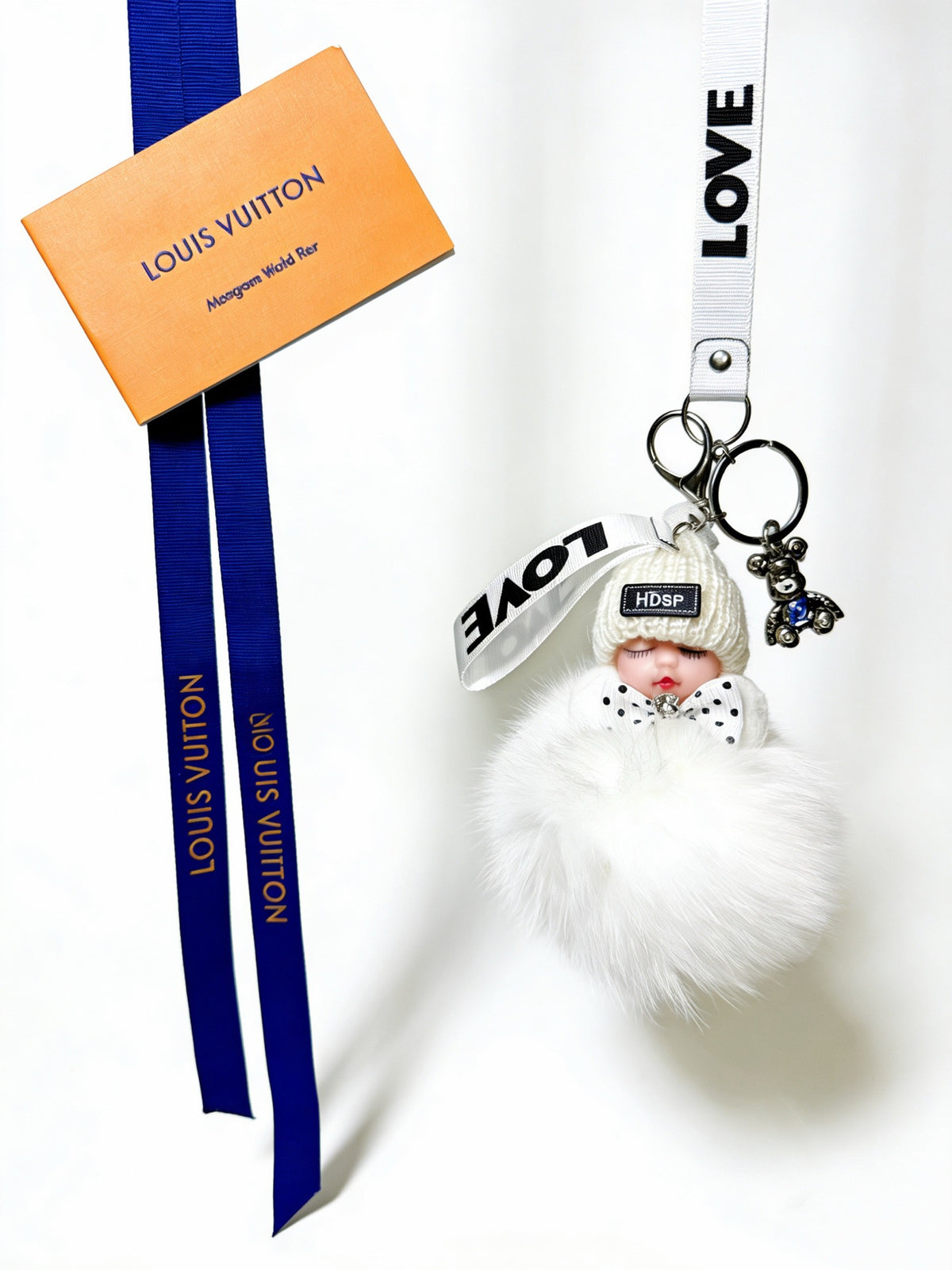 Louis Vuitton White Furry Ball Keychain - album image 1