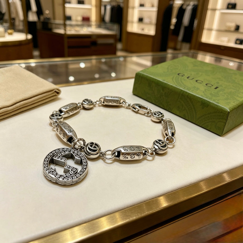 Gucci Silver-Tone Rectangular Link Bracelet with Medallion Charm - album image 2