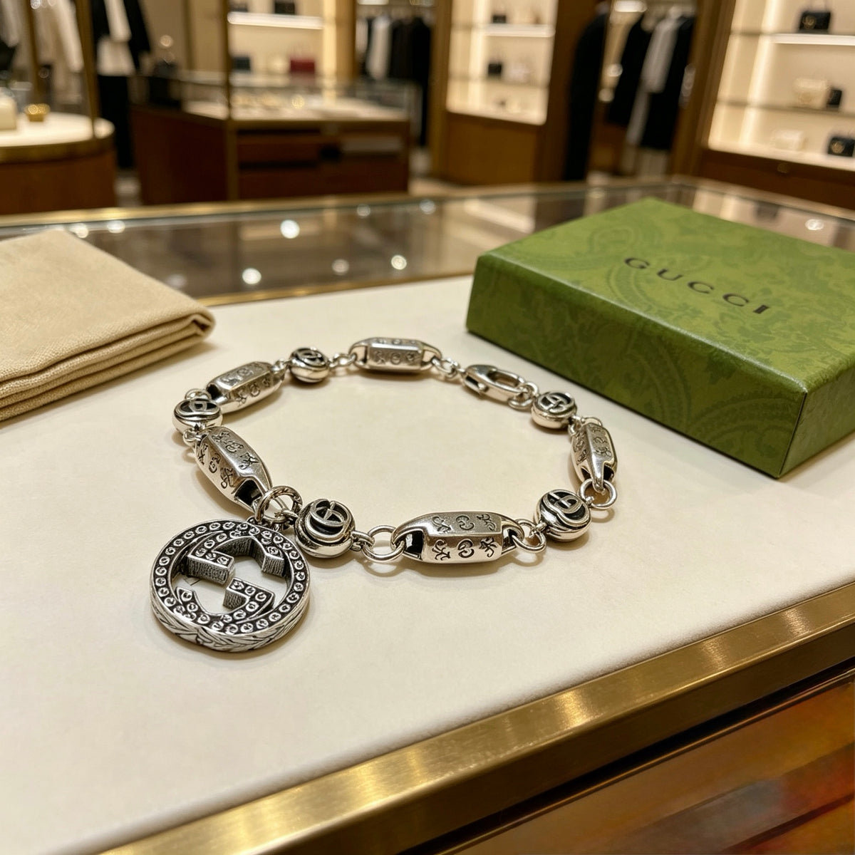 Gucci Silver-Tone Rectangular Link Bracelet with Medallion Charm - album image 2