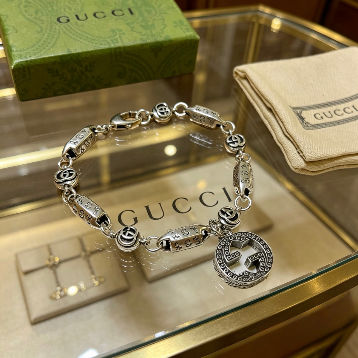 Gucci Silver-Tone Rectangular Link Bracelet with Medallion Charm - album image 8