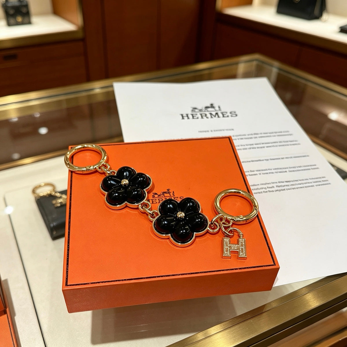 Hermès Black Flower-Charm Keychain - album image 2