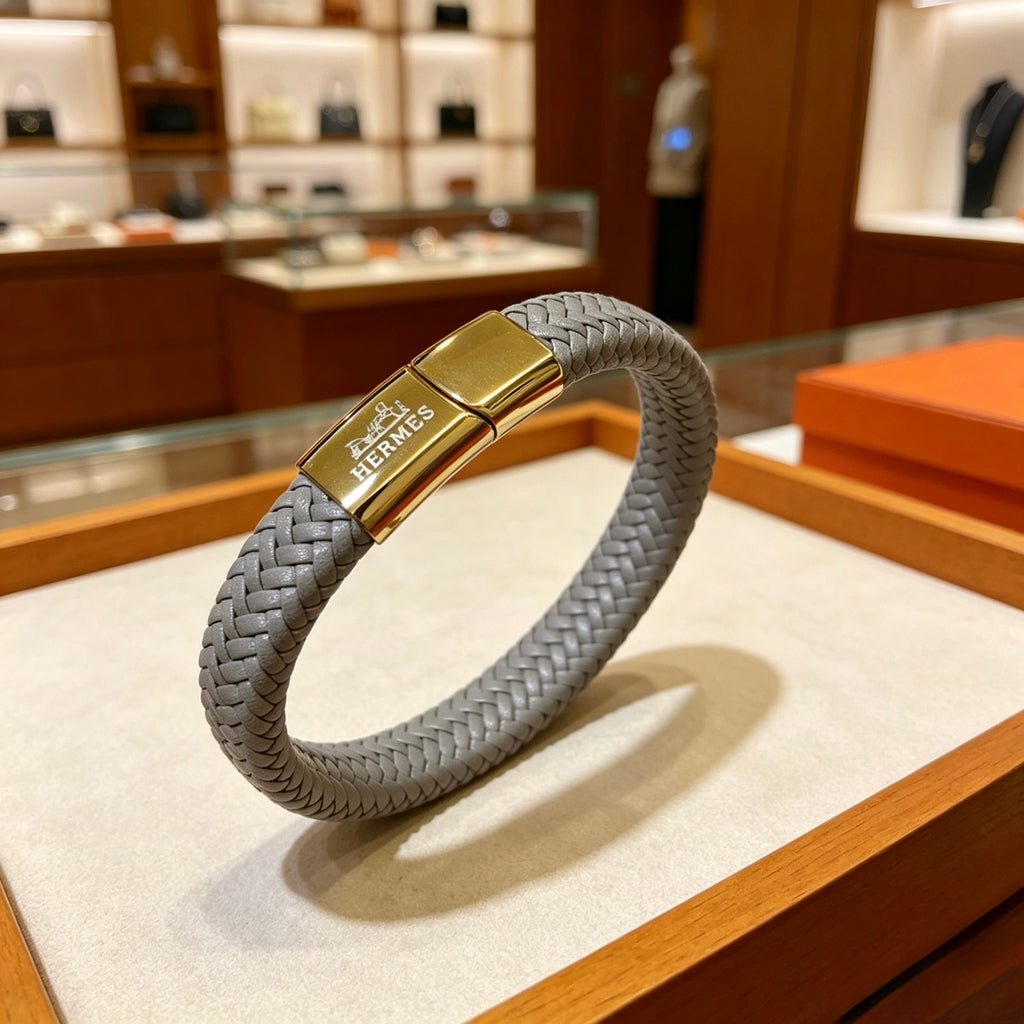 Hermès Black Braided Leather Gold-Tone Clasp Bracelet - album image 1