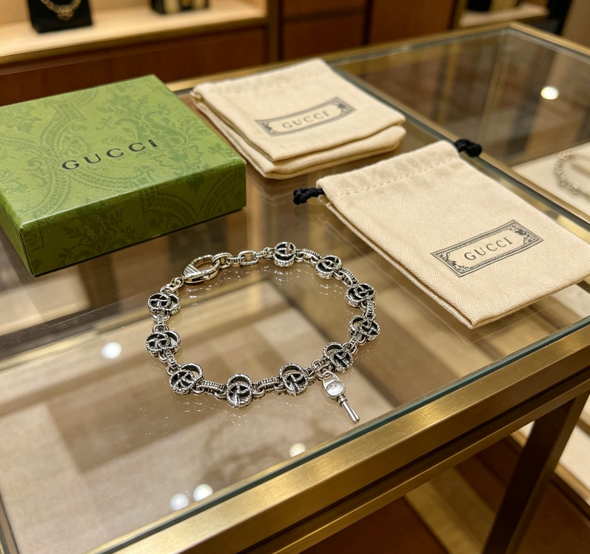 Gucci Silver-Tone GG Medallion Link Bracelet - album image 7